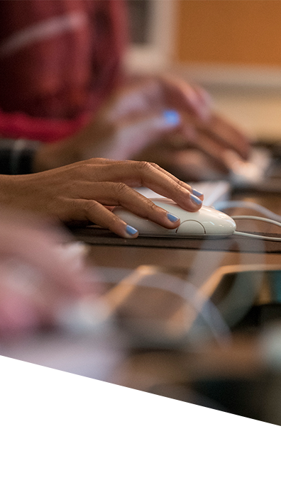 Our History background image hand on computer mouse