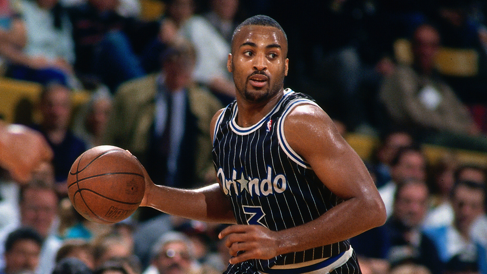 Orlando Magic v Boston Celtics BOSTON, MA - 1994: Dennis Scott #3 of the Orlando Magic dribbles the ball against the Boston Celtics circa 1994 at the Boston Garden in Boston, Massachusetts. NOTE TO USER: User expressly acknowledges and agrees that, by downloading and or using this photograph, User is consenting to the terms and conditions of the Getty Images License Agreement. Mandatory Copyright Notice: Copyright 1994 NBAE (Photo by Nathaniel S. Butler/NBAE via Getty Images)