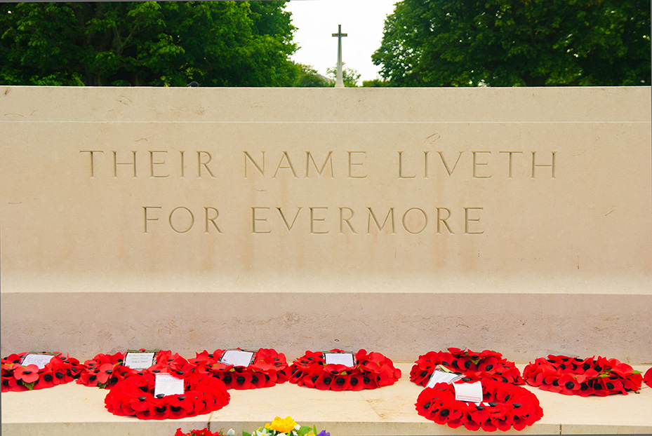 Altar with cross and flowers on the British war cemetery in Bayeux, Normandy, France